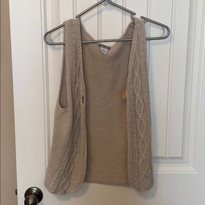 Khaki vest with button. Size medium